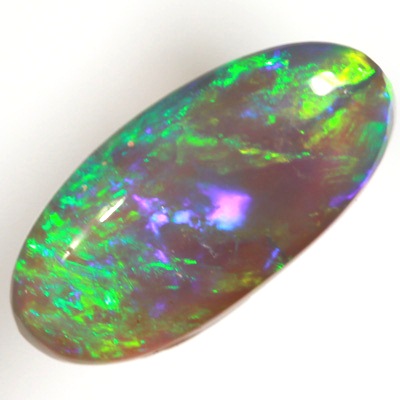 SOLID BLACK CRYSTAL OPAL Rolling flashes of green over purple fire